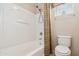 Bright bathroom featuring a shower-tub combination and a neutral-toned shower curtain at 7734 W Terri Lee Dr, Phoenix, AZ 85035