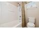 Bathroom with a shower-tub combo, toilet, and neutral color scheme for a fresh, clean look at 7734 W Terri Lee Dr, Phoenix, AZ 85035