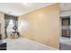 Comfortable carpeted bedroom with window, closet and bonus cabinet area, offers plenty of space at 7734 W Terri Lee Dr, Phoenix, AZ 85035