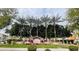 Landscaped community entrance sign surrounded by mature palm trees at 7734 W Terri Lee Dr, Phoenix, AZ 85035