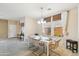Bright dining area features a modern white table, stylish chairs, and natural light from the window at 7734 W Terri Lee Dr, Phoenix, AZ 85035