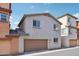 View of home with two-car garage featuring a neutral stucco facade and tile roof in a residential neighborhood at 7734 W Terri Lee Dr, Phoenix, AZ 85035