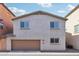 Charming home featuring a two-car garage and a neutral stucco facade, complemented by a tile roof at 7734 W Terri Lee Dr, Phoenix, AZ 85035