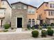 Charming two-story home featuring a stone facade, front patio, and desert landscaping at 7734 W Terri Lee Dr, Phoenix, AZ 85035