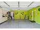 Spacious garage with storage cabinets, colorful accents, and a well-lit interior at 7734 W Terri Lee Dr, Phoenix, AZ 85035