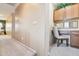 Hallway includes a built in desk and cabinet area. Natural lighting, carpet and a neutral palette at 7734 W Terri Lee Dr, Phoenix, AZ 85035