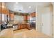 Fully equipped kitchen with stainless steel appliances and wooden cabinets offers plenty of storage at 7734 W Terri Lee Dr, Phoenix, AZ 85035