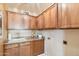 Well-organized laundry room with ample cabinet space and modern appliances at 7734 W Terri Lee Dr, Phoenix, AZ 85035