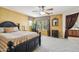 Spacious carpeted main bedroom with neutral color palette, large windows and ensuite bathroom at 7734 W Terri Lee Dr, Phoenix, AZ 85035