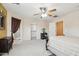 The main bedroom shows a walk-in closet, an ensuite bathroom, and a ceiling fan at 7734 W Terri Lee Dr, Phoenix, AZ 85035