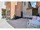 Inviting outdoor patio with comfortable seating and a view of the well-maintained exterior at 7734 W Terri Lee Dr, Phoenix, AZ 85035