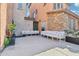 A quaint patio features outdoor seating and a serene atmosphere with a waterfall feature at 7734 W Terri Lee Dr, Phoenix, AZ 85035