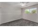 Serene bedroom featuring new carpeting, ample natural light, and a ceiling fan at 8716 E Holly St, Scottsdale, AZ 85257