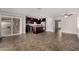 Open-concept living room with tile floors, seamlessly connecting to the kitchen and outdoor patio at 8716 E Holly St, Scottsdale, AZ 85257