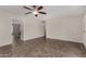 Comfortable living area with a ceiling fan, tile flooring, and natural light, perfect for relaxing at 8716 E Holly St, Scottsdale, AZ 85257