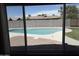 View of the private backyard pool and landscaping from inside the home at 8716 E Holly St, Scottsdale, AZ 85257