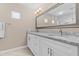 This bathroom features double sinks, granite countertops, and modern fixtures at 9100 E Raintree Dr # 239, Scottsdale, AZ 85260