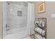 Modern bathroom features marble-tiled shower, new shower head, and functional storage space at 9100 E Raintree Dr # 239, Scottsdale, AZ 85260