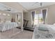 Spacious bedroom features natural light, exercise equipment, and a full-length mirror at 9100 E Raintree Dr # 239, Scottsdale, AZ 85260