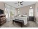 This bedroom showcases a neutral palette, plush carpet, and ample natural light at 9100 E Raintree Dr # 239, Scottsdale, AZ 85260