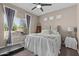 Bright bedroom with natural light, a ceiling fan, and views of the outdoors at 9100 E Raintree Dr # 239, Scottsdale, AZ 85260