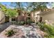 Inviting condo exterior with a well maintained walkway and desert landscaping leading to unit number 13 at 9100 E Raintree Dr # 239, Scottsdale, AZ 85260