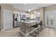 Modern kitchen features a spacious island with bar seating, stainless steel appliances, and sleek white cabinetry at 9100 E Raintree Dr # 239, Scottsdale, AZ 85260