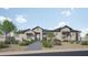 Charming single-story home featuring stone accents, a tiled roof, desert landscaping, and a welcoming entrance at 11140 W Prospector Dr, Queen Creek, AZ 85144