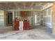 Spacious living room featuring unfinished walls and ceiling, ready for customization at 11140 W Prospector Dr, Queen Creek, AZ 85144