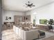 Open-concept living room with a kitchen, a dining area, comfortable seating, and ample natural light at 11140 W Prospector Dr, Queen Creek, AZ 85144