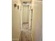 Hallway features carpeted flooring, white doors, and textured walls at 13783 W Caribbean Ln, Surprise, AZ 85379