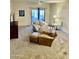 Inviting living room featuring a sofa, ottoman, and carpet, creating a cozy atmosphere at 13783 W Caribbean Ln, Surprise, AZ 85379