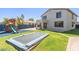 Large backyard with play structure, trampoline, and spacious lawn at 15324 W Windsor Ave, Goodyear, AZ 85395