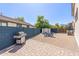 Spacious backyard featuring a brick patio, gravel area with seating, and a storage shed at 15324 W Windsor Ave, Goodyear, AZ 85395