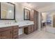Bathroom showcasing double sinks, vanity area, and cabinetry offering convenient access to the Primary bedroom at 15324 W Windsor Ave, Goodyear, AZ 85395