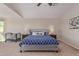 Bright bedroom featuring blue patterned bedding, neutral walls, and carpet flooring for a cozy and inviting space at 15324 W Windsor Ave, Goodyear, AZ 85395