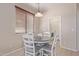 Cozy breakfast nook featuring a round table, seating for four, and natural light at 15324 W Windsor Ave, Goodyear, AZ 85395