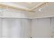 Well-organized closet featuring ample shelving and a hanging rod for maximum storage capacity at 15324 W Windsor Ave, Goodyear, AZ 85395