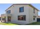View of the home's exterior, featuring a spacious backyard and contemporary architectural details at 15324 W Windsor Ave, Goodyear, AZ 85395