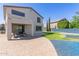 Exterior showcasing a well-maintained backyard, covered patio, and lush lawn for outdoor enjoyment at 15324 W Windsor Ave, Goodyear, AZ 85395