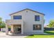 Back of the house, featuring a covered patio and large windows at 15324 W Windsor Ave, Goodyear, AZ 85395