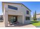Well-maintained home exterior with a covered patio and lush backyard, perfect for Gathering gatherings at 15324 W Windsor Ave, Goodyear, AZ 85395