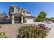 Beautiful two-story home with desert landscaping in the front yard at 15324 W Windsor Ave, Goodyear, AZ 85395