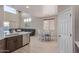 Bright open-concept with breakfast nook, view of sectional, and natural lighting at 15324 W Windsor Ave, Goodyear, AZ 85395