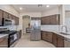 Well-lit kitchen with stainless steel appliances and ample cabinet space at 15324 W Windsor Ave, Goodyear, AZ 85395