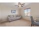 Relaxing living room featuring comfortable seating, natural light, and a serene atmosphere at 15324 W Windsor Ave, Goodyear, AZ 85395