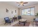 Cozy living room with natural light, laminate floors, and tasteful decor at 15324 W Windsor Ave, Goodyear, AZ 85395