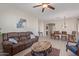 Open-concept living and dining area with laminate floors and neutral colors at 15324 W Windsor Ave, Goodyear, AZ 85395