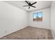 Bright carpeted bedroom featuring a window with a scenic backyard view and neutral colored walls at 2036 S Reseda Ct, Gilbert, AZ 85295