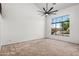 Inviting bedroom with large windows offering scenic views, and plush carpeting at 2036 S Reseda Ct, Gilbert, AZ 85295